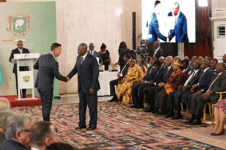 handshake between said Alassane Ouattara and Koen De Backker